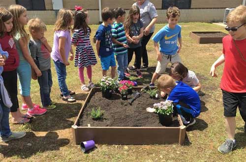 photo of Stagecoach Elementary students planting garden